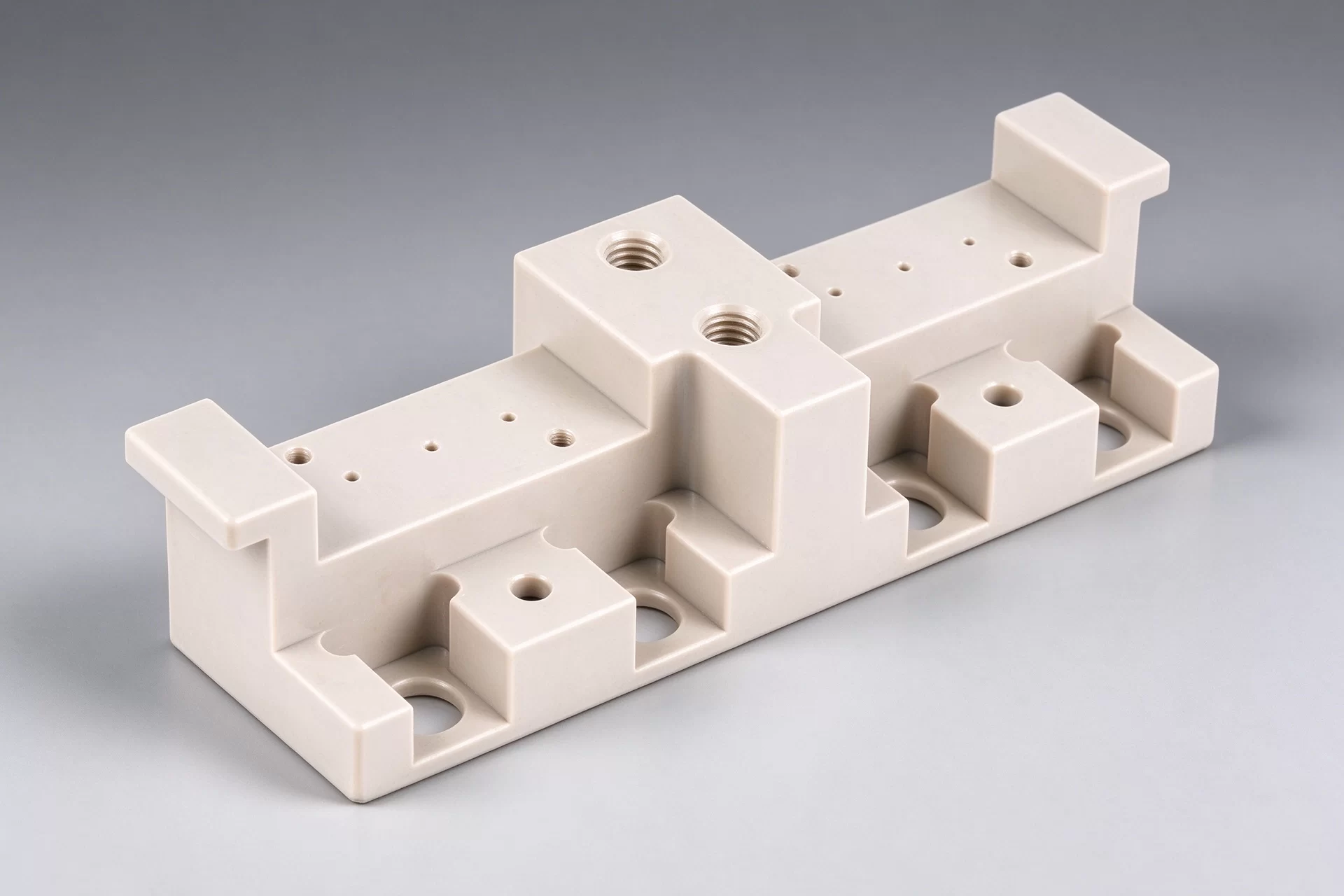 PEEK Insulation Mounting Base with Reinforcing Ribs CNC machined PEEK insulating structural base, multiple mounting holes and ribbed supports for semiconductor and electrical fixtures