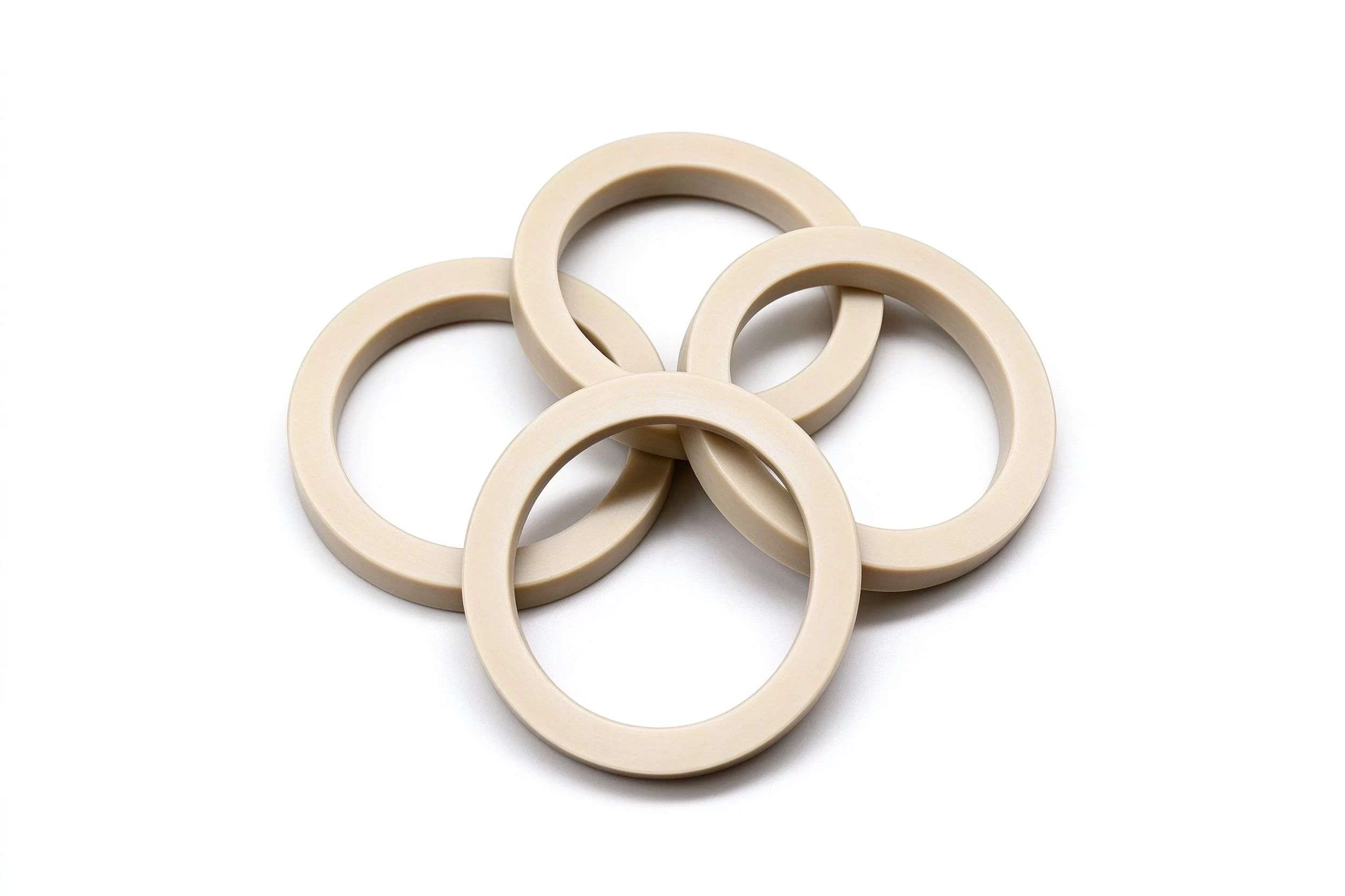 PEEK rollers, cylindrical pins and annular spacer washers, precision-machined plastic parts